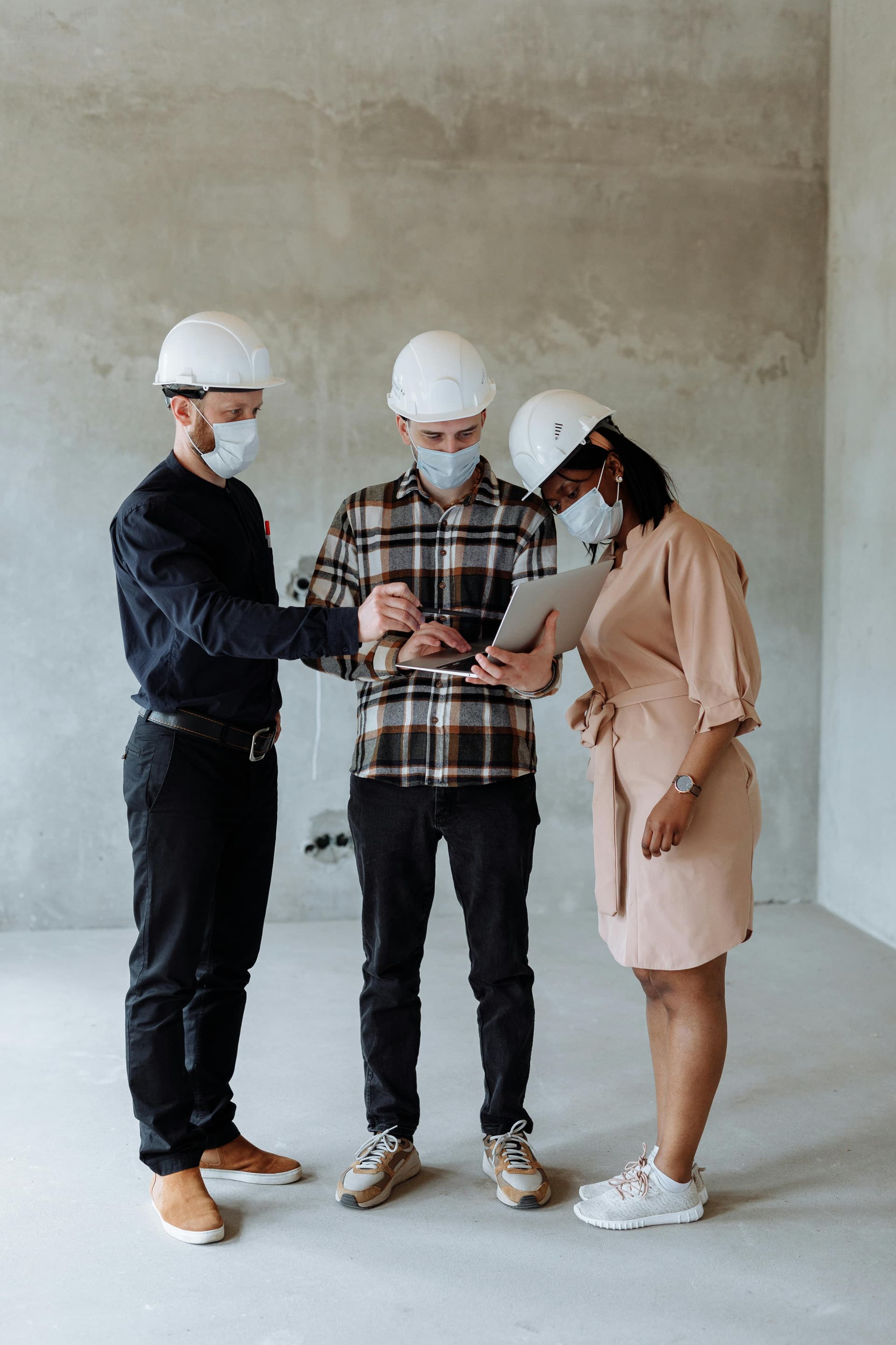 Team reviewing renovation plans on site